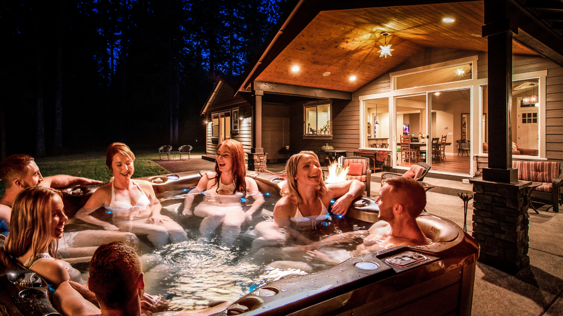 Socialising under night sky in hot tub